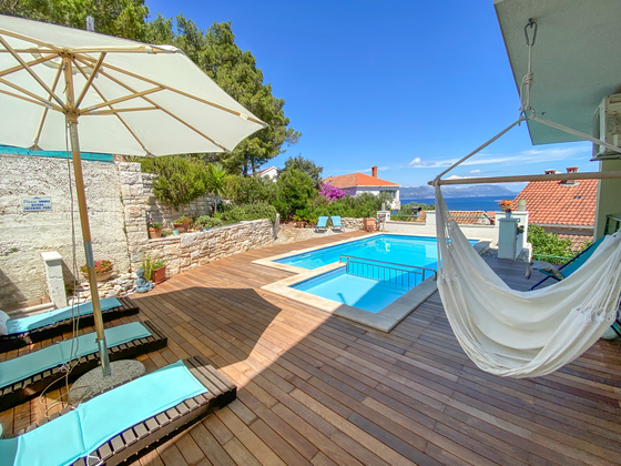 Pool area with the BBQ behind the Pool - Luxury apartment in Lumbarda, Korcula