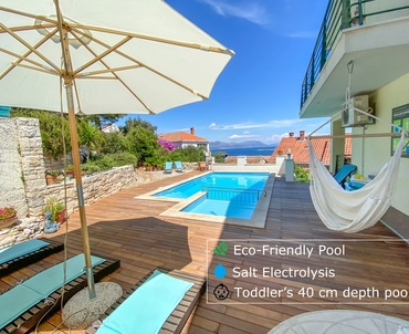 Pool area with the BBQ behind the Pool - Luxury apartment in Lumbarda, Korcula