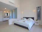 Bedroom with en suite bathroom - with a sea view